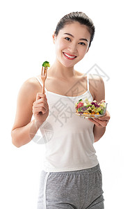 自我完善青年女人吃沙拉高清图片