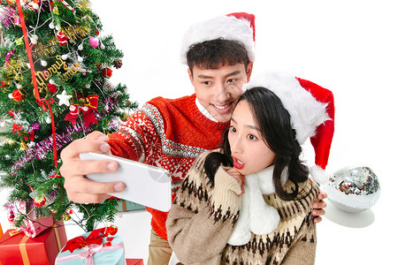 直播礼物圣诞青年情侣用手机照相背景