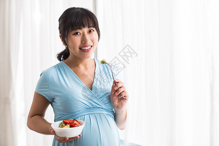 草莓新上市爱怀孕简单幸福的孕妇背景
