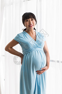 渴望东方人期待幸福的孕妇图片