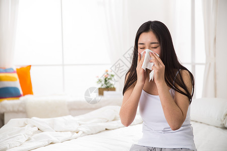 床上用品早晨摄影青年女人生病图片