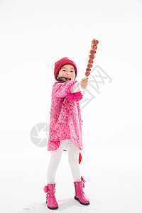 过年祝福仅一个女孩欢乐的小女孩吃糖葫芦图片