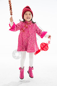 仅女孩5到6岁亚洲欢乐的小女孩吃糖葫芦图片