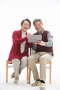科技关怀老年夫妇用平板电脑背景
