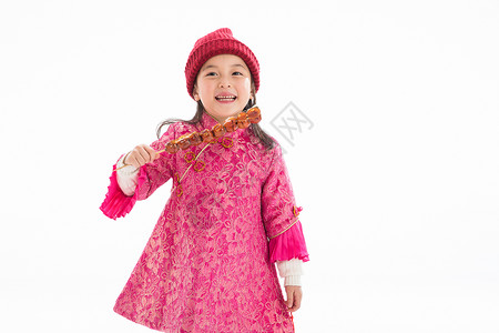 传统庆典影棚拍摄中式衣领欢乐的小女孩吃糖葫芦图片