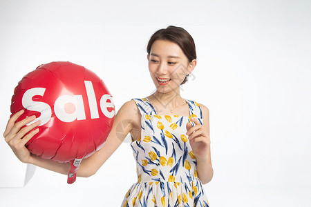 英文购物标签人幸福东亚快乐的年轻女孩拿着气球背景