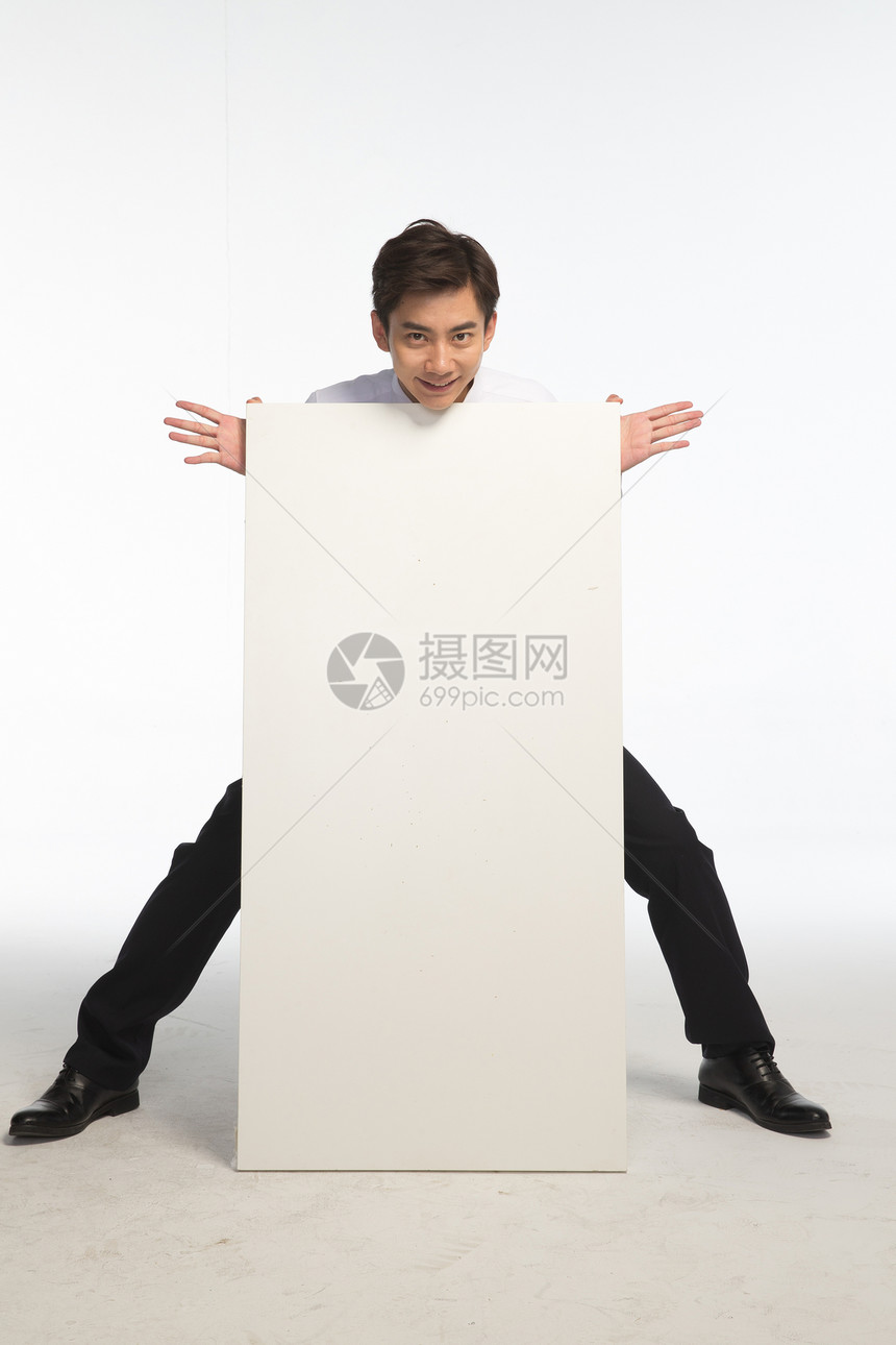 亚洲人展示成就商务青年男人和白板图片