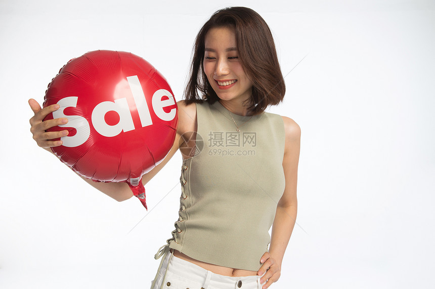 东亚轻松满意快乐的年轻女孩拿着气球图片