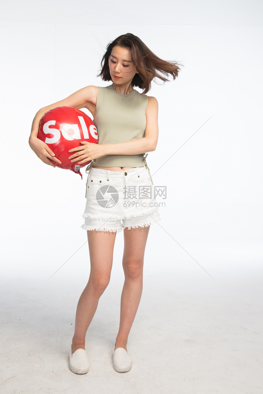 仅一个青年女人东方人东亚年轻女孩拿着气球图片