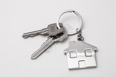 钥匙圈公寓钥匙与房子吊饰背景