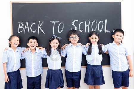 61儿童节纯英文海报幸福可爱的小学生在教室里背景