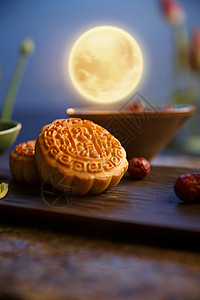 中秋节月饼和月亮创意摆拍图片