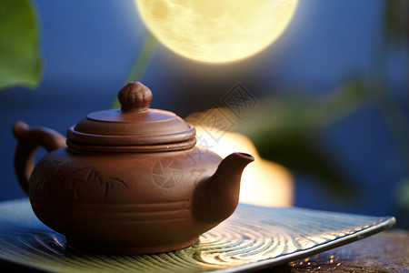 瓷器月色茶具背景图片