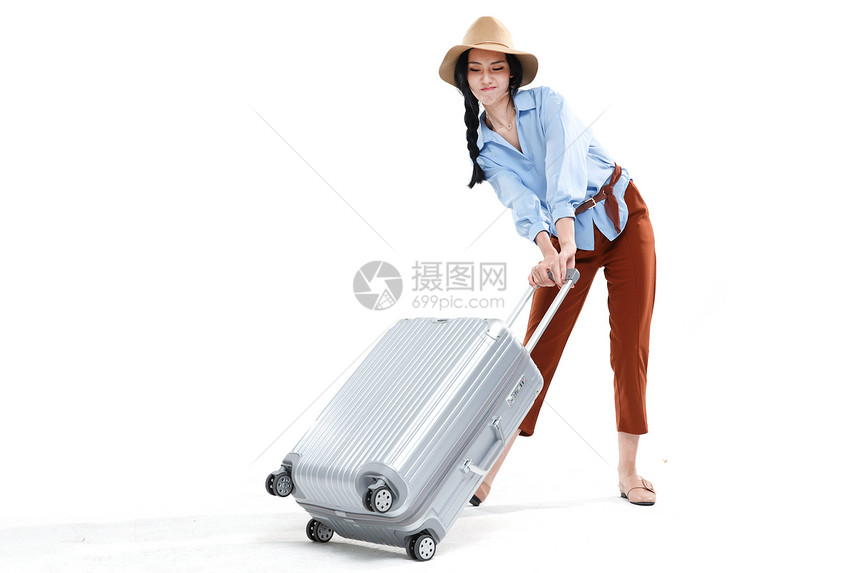 行李箱不看镜头时尚青年女人旅行图片