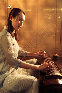 旗袍古典女人弹七弦琴背景图片