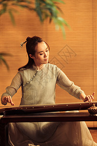 旗袍古典女人弹七弦琴背景图片