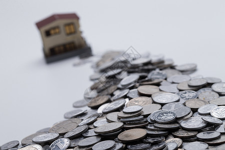 财务项目硬币和房屋模型背景