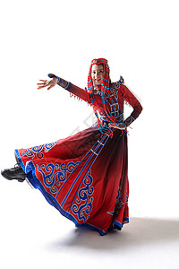 幸福舞蹈家注视镜头穿着蒙古族服饰的女人图片