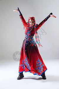 蒙古人舞蹈家装饰物穿着蒙古族服饰的女人背景图片