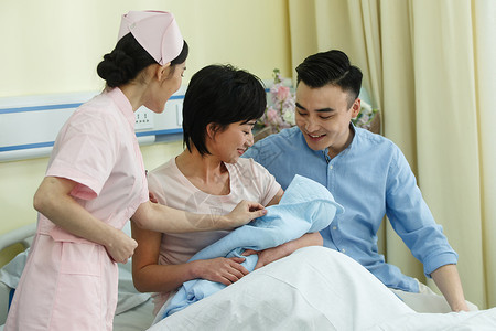 新职业亚洲技能职业护士和新生儿的父母背景