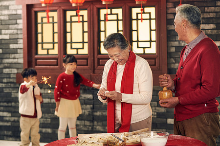 烟花元素设计节日东方人快乐幸福家庭过年包饺子背景
