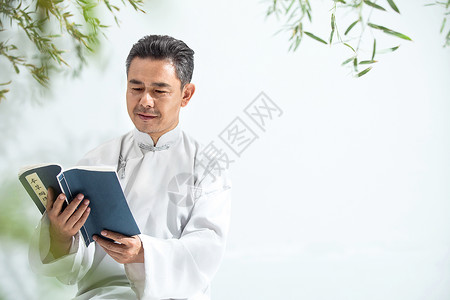 读书元素穿着唐装长袍的中年男人看书背景