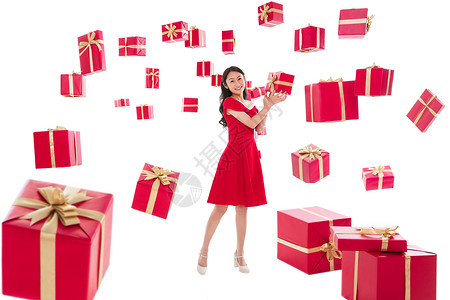 愉悦圣诞礼物丝带漂亮的年轻女人与礼物图片