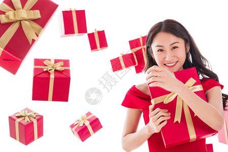 成年人红色金色漂亮的年轻女人与礼物图片