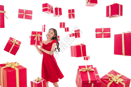 礼品盒惊喜圣诞礼物漂亮的年轻女人与礼物图片