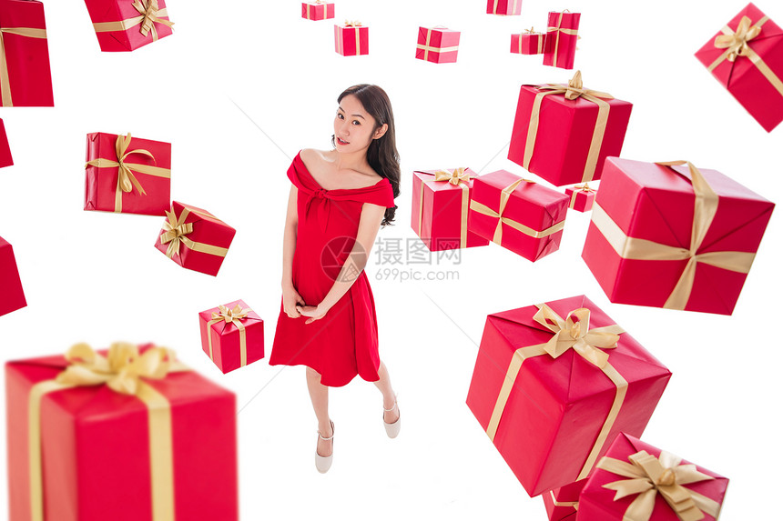 金色成年人礼品盒漂亮的年轻女人与礼物图片