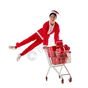 圣诞帽消费抢时间穿圣诞服的青年男人推着购物车图片