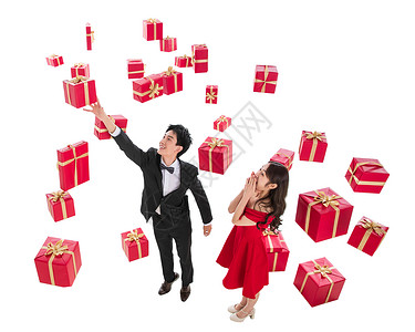 漂亮红色丝带礼服高跟鞋西装伸手接礼物的幸福伴侣背景