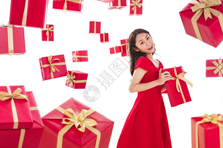 一个青年女人落下愉悦漂亮的青年女人拿着礼物图片