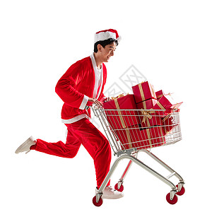 享乐圣诞帽抢时间穿圣诞服的青年男人推着购物车图片