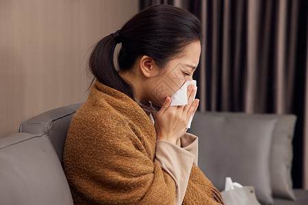 女性生病感冒擦鼻涕背景图片