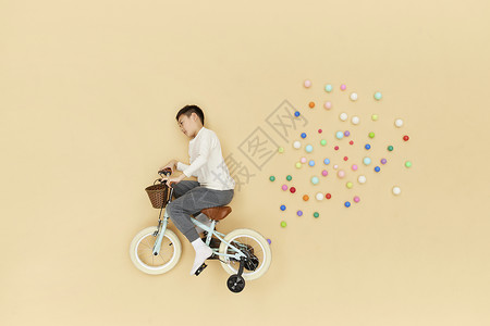 骑自行车的学生骑着自行车飞在空中的儿童形象背景