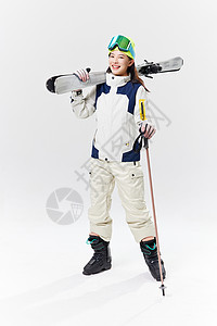 年轻美女拿着滑雪板图片