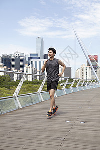 户外运动跑步的男青年背景图片