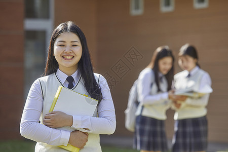 前视图背包秘书高中生学习书本图片