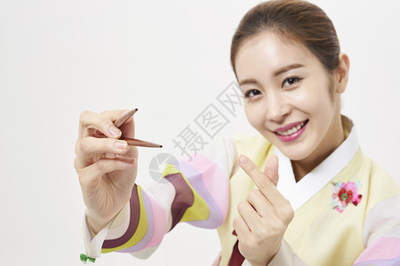 快乐韩服女人拿着筷子图片