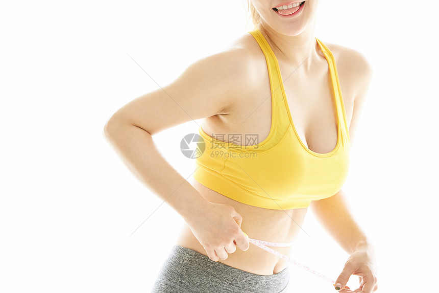 女性测量腰围特写图片