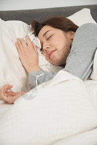 睡在床上的女人背景图片