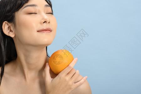 橘子女孩简约干净的女性美容护肤形象背景