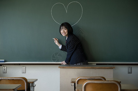 教室认真上课的高中生男女同学背景图片