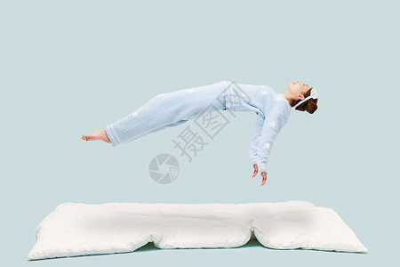 悬浮床睡衣少女悬浮在空中背景