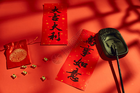 红包元宝漂浮春节年货和对联背景