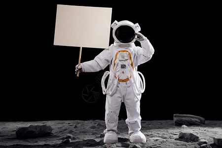 童装招牌素材创意宇航员站在月球表面上手拿指示牌背景