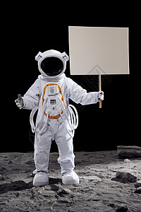 招牌鱼形素材站在月球表面上手拿指示牌的宇航员背景