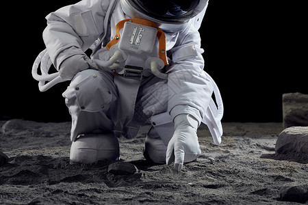 月球地面宇航员手碰触地面背景