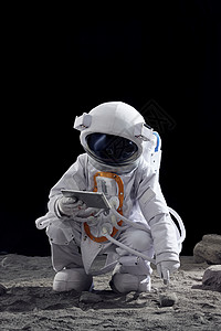 太空中使用平板电脑的宇航员背景图片
